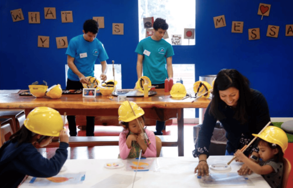 Children try painting like artist Donald Ryker Hard Hat painter