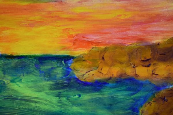 Close-up of A rocky coast with high water marks circles the deep blue ocean with a glowing sunset, blue skies and a sandy beach foreground. Blue, Orange, Yellow, Purple. Large Painting by artist Donald Ryker in textured expressionist impressionist art style with unique impasto glaze technique.